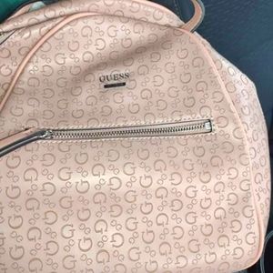 It is a rose gold guess back pack